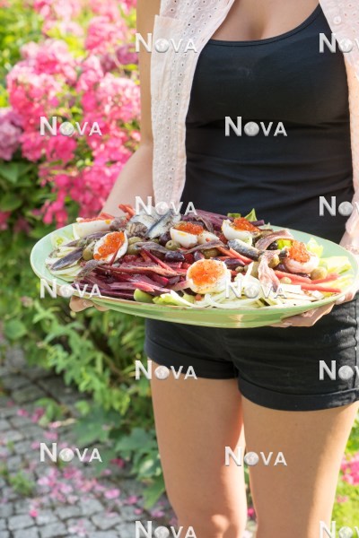 N1005549 Girl in the garden with salad platter
